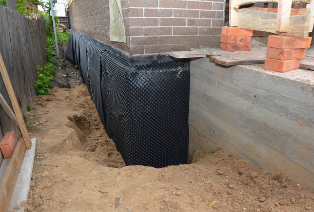 SJ Waterproofing Pros technician performing targeted Sump Pump Installation assessment in Sturgeon Bay, WI